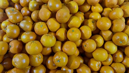 Fresh, vibrant tangerines overflowing, perfect for healthy eating, juice, and delicious recipes