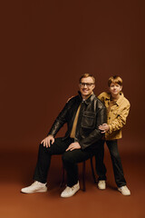 Happy Moments Captured in Studio with Father and Son in Stylish Casual Outfits