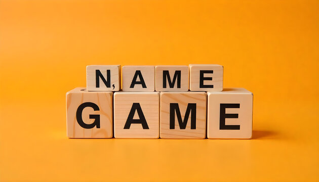 Name of the game symbol. Wooden blocks with concept words Name Game. Beautiful orange table orange background. Business and name of the game concept. Copy space.