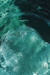 Rippling water surface displays mesmerizing turquoise hues and g