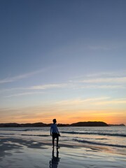 Fototapeta premium Silhouette on Serena Beach at Sunset