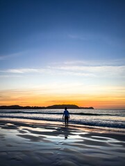 Fototapeta premium A Silhouette on Sunset Beach