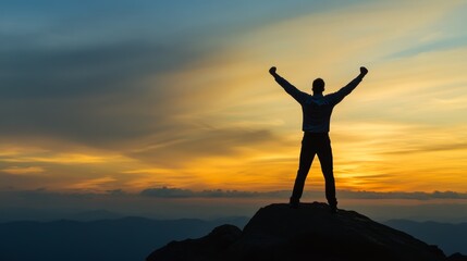 Silhouette of a victorious man standing on a mountain peak with arms raised, symbolizing success, achievement, leadership, and personal growth in a business and motivational concept.