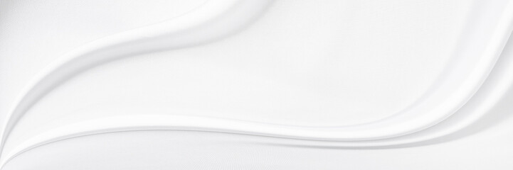 White gray satin texture that is white silver fabric silk panorama background with beautiful soft blur pattern natural.