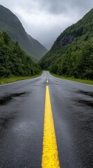 Fototapeta premium A breathtaking scenic highway winds its way through lush, green mountains that rise majestically beneath a cloudy sky