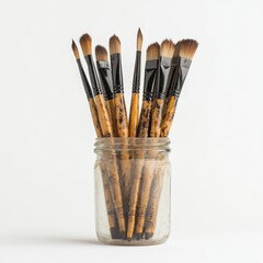 Collection of Professional Paint Brushes in a Glass Jar Display