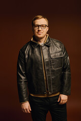 Handsome man showcasing casual style in a modern studio setting