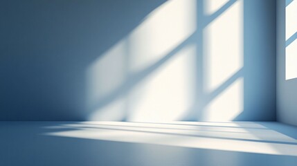 Sunlight and shadows on the white wall inside a building