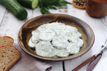 A traditional Polish salad Mizeria in rustic style	
