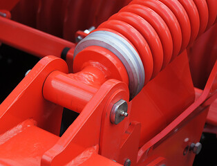 Fastening of the helical coil springs to the frame