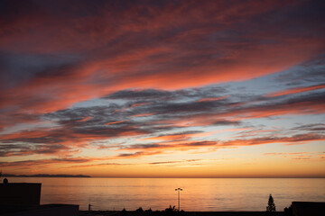 Beautiful of luxury soft gradient orange gold clouds and sunlight on the blue sky perfect for the...