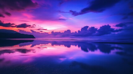 Fototapeta premium Vibrant sunset reflecting on tranquil ocean beach.