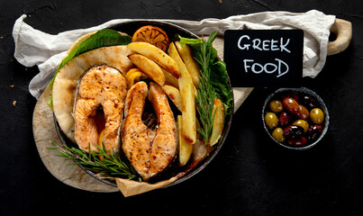 Grilled salmon with potato in menu..