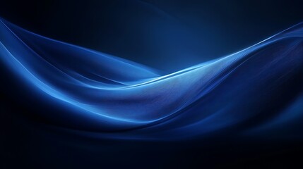 Abstract blue waves flowing gracefully across a dark background space