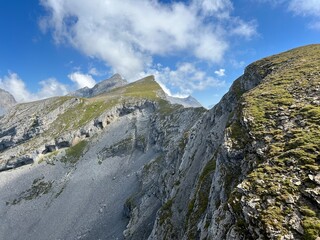 Alpine peaks Chli Hohmad (2492 m) and Gross Hohmad (2307 m) above the Tannensee lake (or Tannen lake) and in the Uri Alps mountain massif, Melchtal - Canton of Obwalden, Switzerland (Schweiz)