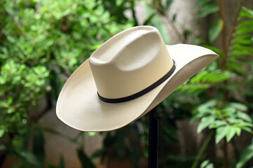 cowboy style hat straw hat with black ribbon isolated on white background, straw hat for women and men head protection