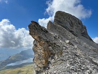 Alpine peaks Chli Hohmad (2492 m) and Gross Hohmad (2307 m) above the Tannensee lake (or Tannen lake) and in the Uri Alps mountain massif, Melchtal - Canton of Obwalden, Switzerland (Schweiz)