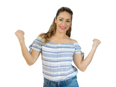 Young smiling woman making winner gesture isolated over transparent background. PNG transparent