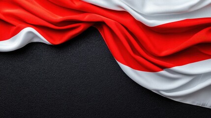 Waving Red and White Fabric on Dark Background with Textured Surface