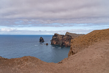 Cliffs and rocks on the middle of the sea on an island of madeira.