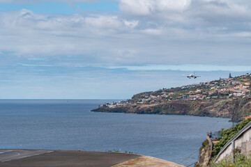 Airplane landing on the island of madeira.