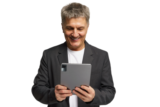 Middle-aged man smiles while using a tablet in a bright setting for work or leisure activities