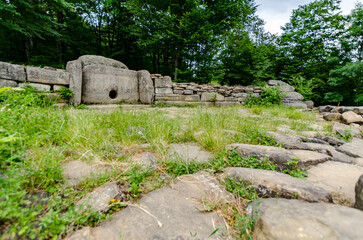 Ancient stone dolmen in lush forested area