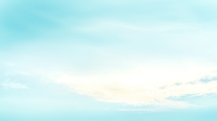 A soft light blue sky with a few cumulus clouds spread across, offering a calming and refreshing atmosphere.