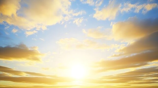 A vibrant sunset sky with golden light reflecting off billowy clouds, filling the sky with a peaceful warmth.