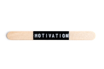 Word Motivation written on wooden stick isolated on white background.