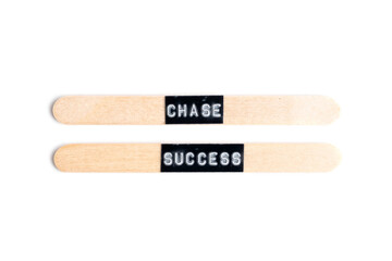 Chase success inscription on wooden slats. On white background.