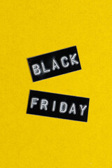 Black Friday sale sign on a yellow background. Black Friday concept.