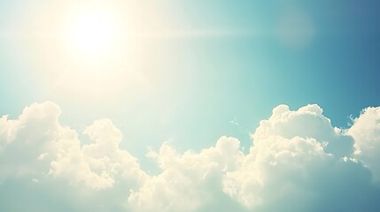 A bright, sunny sky with soft, wispy clouds drifting lazily in the clear blue sky.