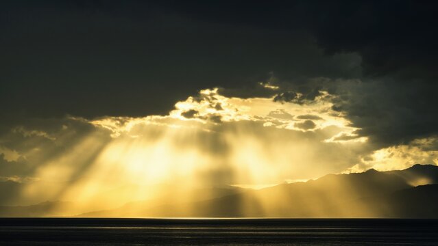 Sun rays in the clouds over Sicily, Tyrrhenian Sea, Italy
