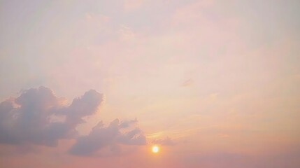 Fototapeta premium A mesmerizing sunset sky filled with rich and vivid colors, transitioning from deep oranges to vibrant pinks and purples as the sun sets.