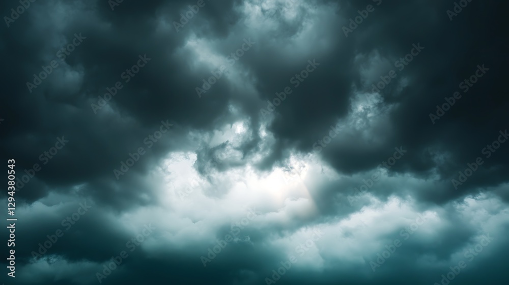 Wall mural a moody sky filled with dark clouds, with gentle rays of sunlight piercing through the clouds, creat