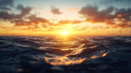 Fototapeta premium Aerial view of sunset over dark blue ocean waves with textured water surface and colorful sky