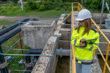 Environmental engineers work at wastewater treatment plants,Water supply engineering working at...