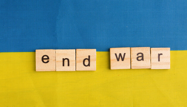 flag of ukraine with words end of war - Powered by Adobe