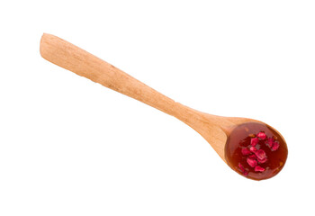 spoon with raspberry jam on white background