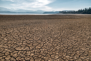 Dry and cracked earth during drought on lake Liptovska Mara in Slovakia