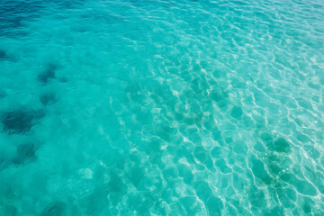 Crystal clear turquoise water at a tropical beach on a sunny day inviting relaxation and adventure