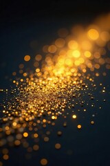 Naklejka premium Gold glittery dust on a dark surface with shining lights, metallic, glitter, sparkle