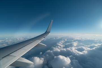 Obraz premium Jets wing gliding above clouds with earth visible in the distance