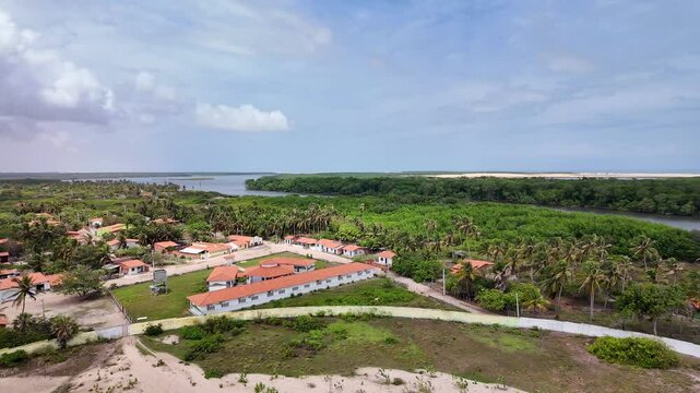 Village of Mandacaru, Barreirinhas, Maranhao, Brazil. Photo taken from the top of the Mandacaru lighthouse, overlooking the Preguicas River, and the Atlantic Ocean in the background.