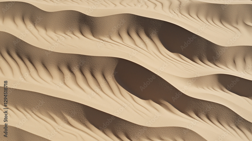 Poster Aerial view of sand dunes with intricate patterns and shadows creating textured landscape