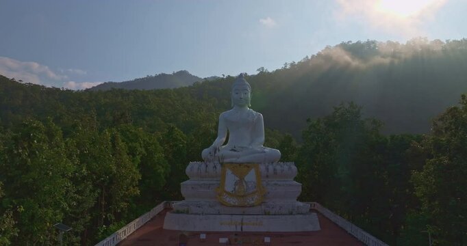 Aerial view Wat Phra That Mae Yen, an ancient temple that has been a symbol of Pai for a long time. Phra Phuttha Lokuttara Mahamuni, a large white Buddha statue in the Mara-Vijaya attitude on hilltop
