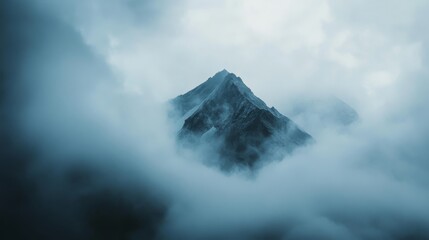 A striking mountain peak emerges through swirling clouds, shrouded in an aura of mystique and power.
