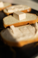 bread with melted cheese on black desk sandwich with melted cheese