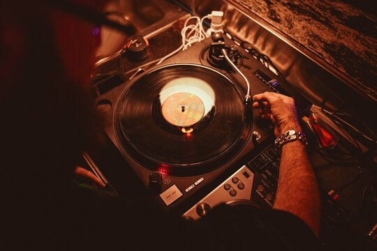 detail of console and dj with turntable during an evening party in a club - Powered by Adobe